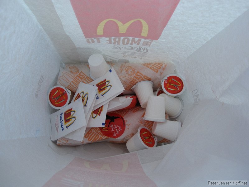 McWTF!\nI'm pretty sure I said either "yes", or "yes ma'm" when she asked me if I wanted cream and sugar with my 16oz coffee. That's 9 (NINE) creamers and six sugar packets for my drive-through order.