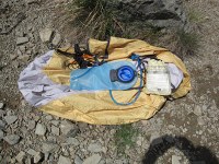 my portion of Laura's 2004 REI Half Dome 2 tent - the rain fly, footprint, pole splint, and 6 titanium stakes, as well as my 100oz camelback reservoir