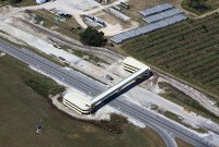 massive bridge over a road by a high school out in the country