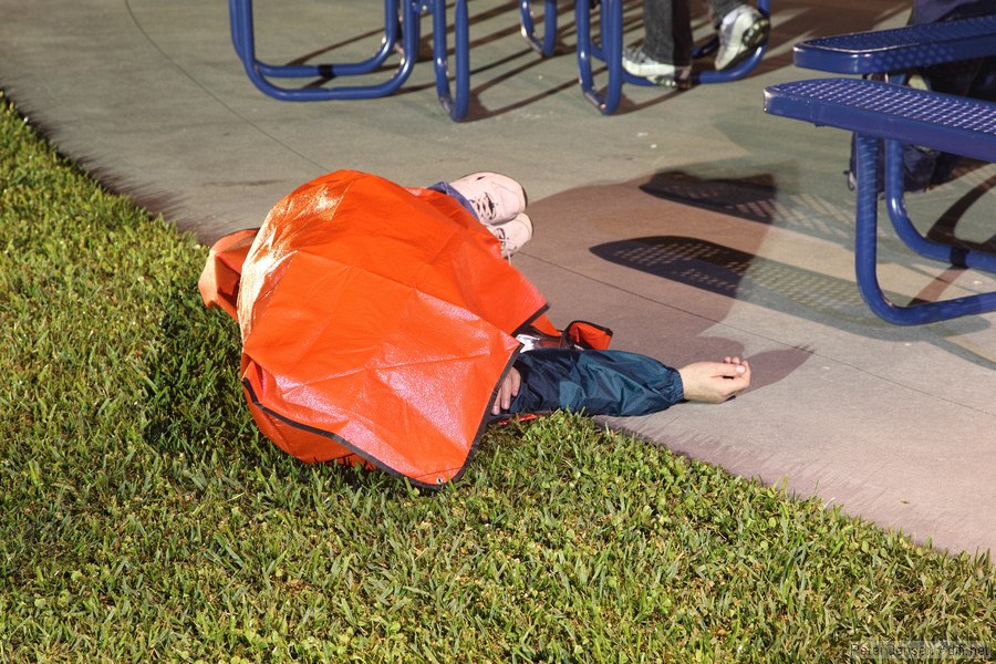 optimal nap-taking situation - feet dry, body comforted by the soft grass, and protected from dew by the space blanket