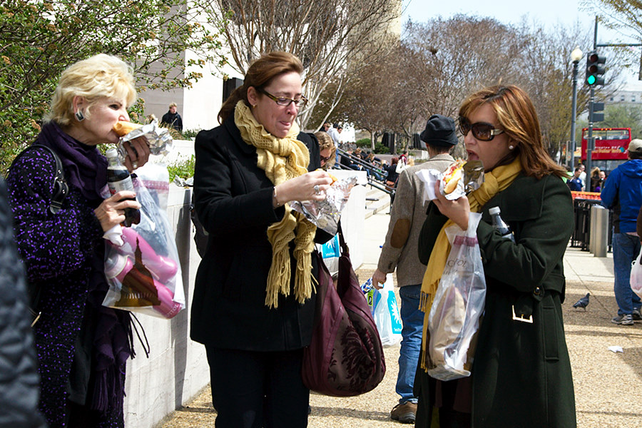 ladies going to town on street dogs