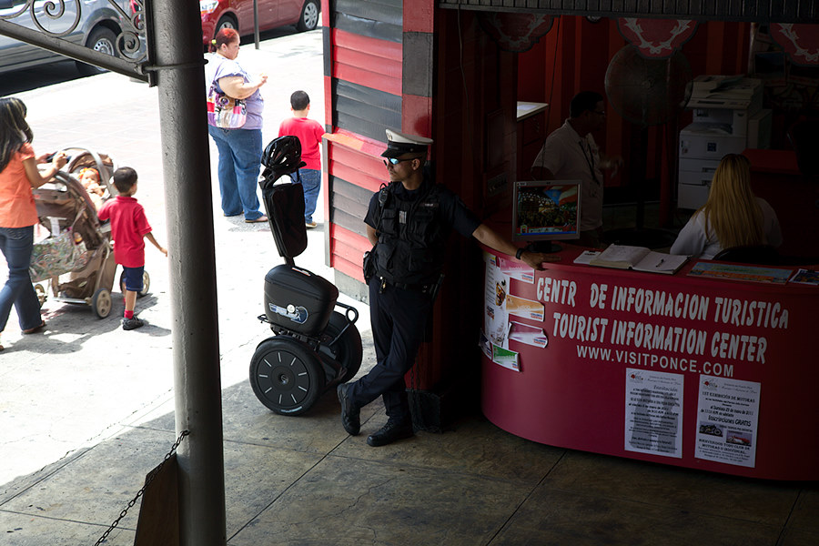 It's hard to look like a badass standing next to a segway, but this guy is trying.