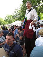 awesome dude on stilts with a super soaker