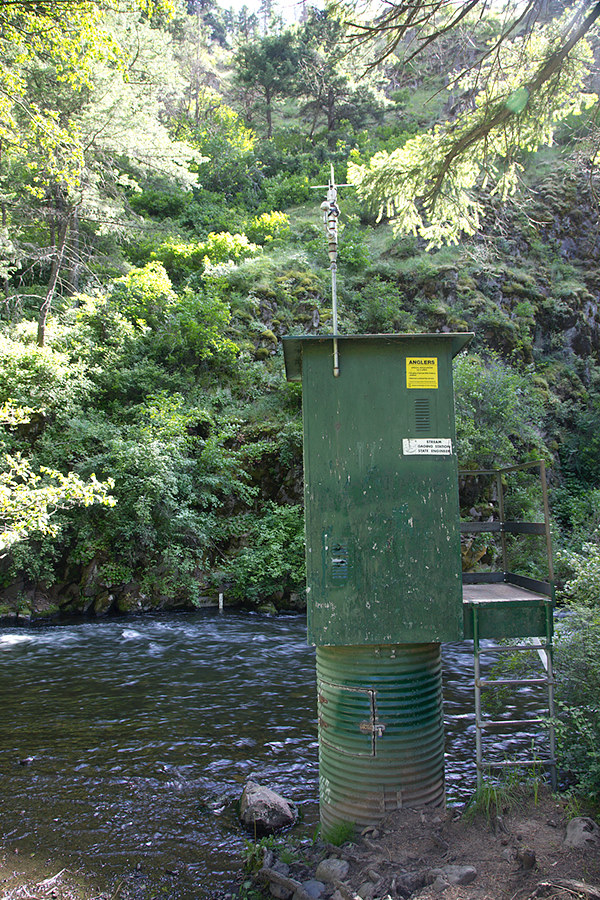 stream gauging station with the satellite antenna boresite pointed straight in to the hill