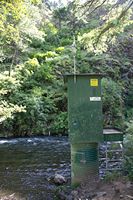 stream gauging station with the satellite antenna boresite pointed straight in to the hill