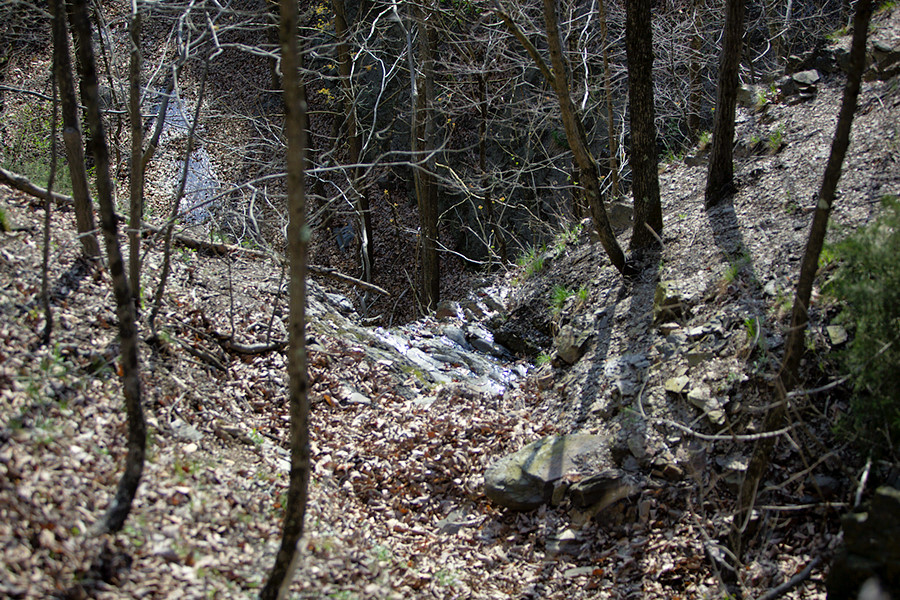 view downhill toward the entrance to a train tunnel