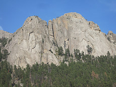 there is at least one climber visible on the right pillar of rock here