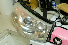 Saturn headlights after - much improved, but I ran kind of short on sanding pads