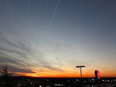 nice contrails while waiting for a delayed flight at Chilis