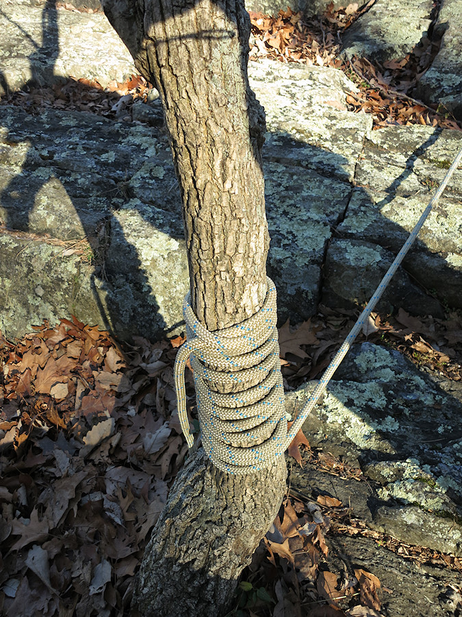 this looked sketchy (despite being relatively secure and strong) until I realized it was just the leftover rope after connecting to an equalized 3-piece gear anchor and a larger tree