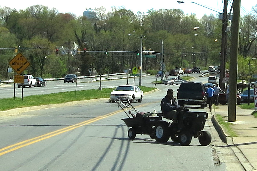 just a dude driving a tractor on the road