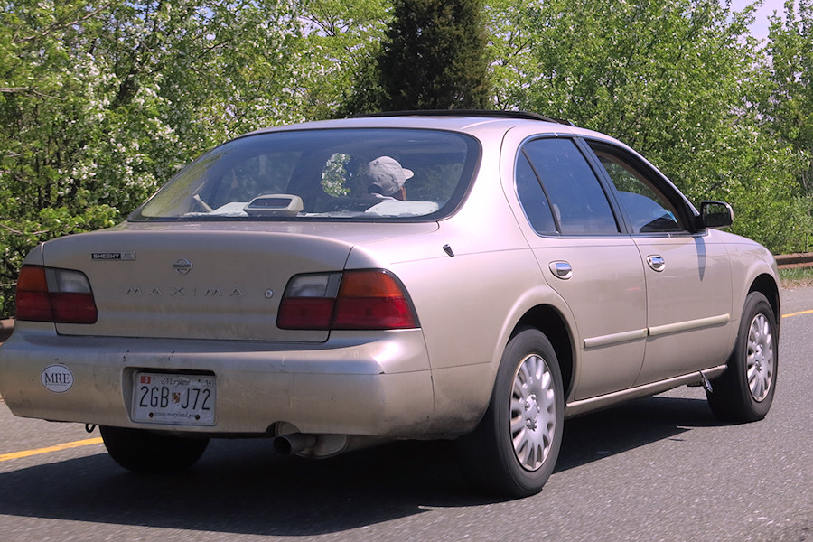 car with an ODB-II scanner plug hanging out the passenger door