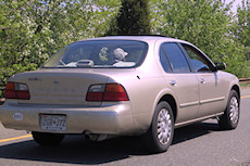 car with an ODB-II scanner plug hanging out the passenger door