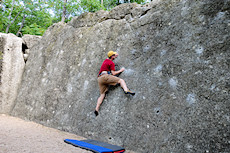climbing Classic (V0) on the Bill Boulder at Bull Creek, Austin, TX. Never mind the 80s crash pad, it's there for visual contrast, not padding :)