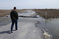 Fowler Beach Rd washout at about 38.879861, -75.271707 (looked waist deep or so)