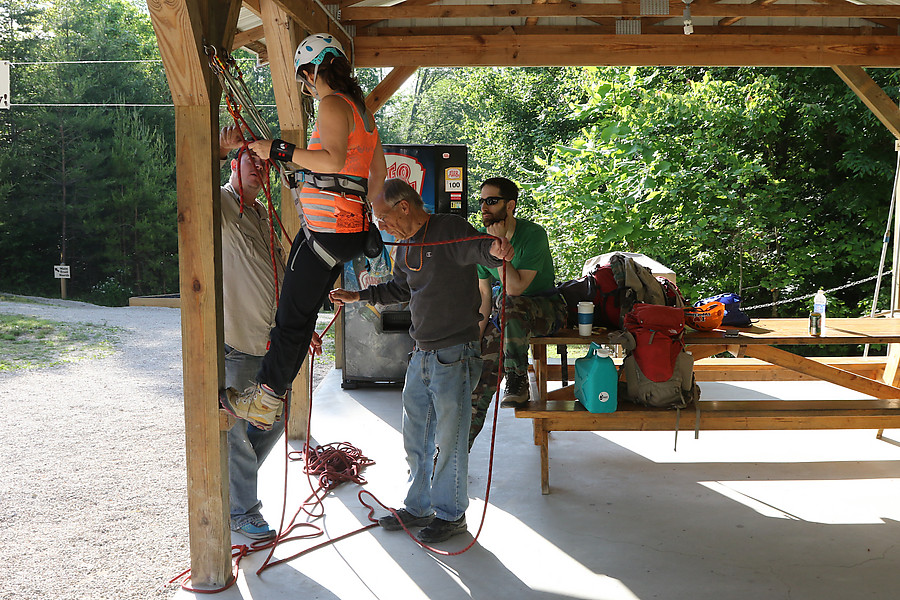 Rick Weber instructing a climber on cleaning at the Muir Valley parking area.