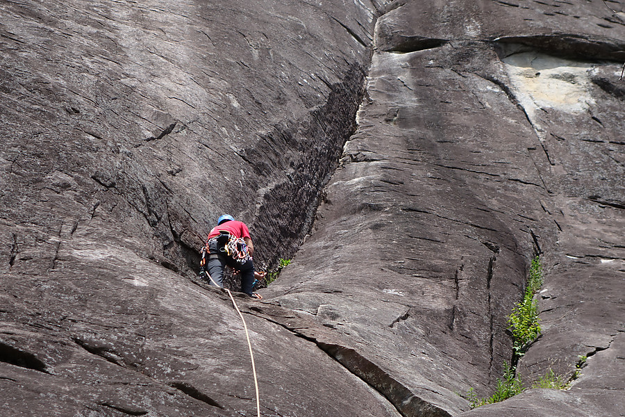 Karsten building a belay at the start of the business on Second Coming, recommended technique to minimize ledge potential from rope stretch in case the leader falls at the crux (top of photo)