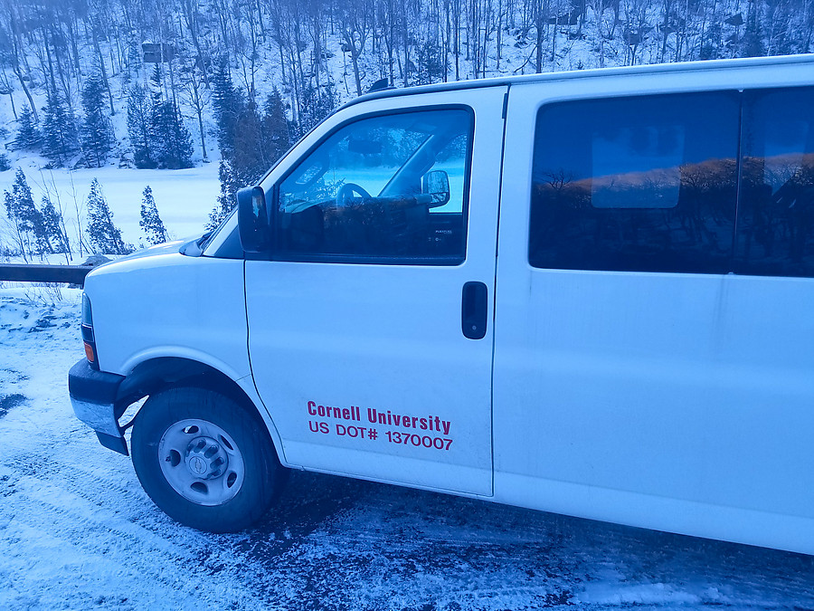 Cornell University parked two 15-passenger vans very inefficiently in the small lot