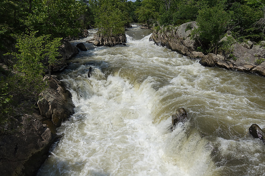 barely visible, stuck on the middle-right rock, is a kayaker's throw bag and line