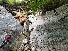 climbers getting it on the Rico Suave buttress at Kaymoor in the rain