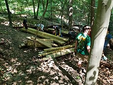 re-stacking part of one of the bridges we carried lumber for