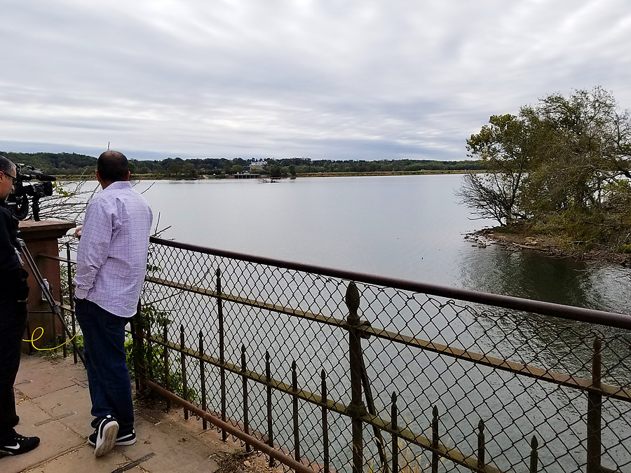 the poor cameraman who always has to shoot trump golfing from across the river