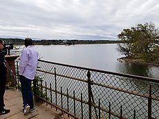 the poor cameraman who always has to shoot trump golfing from across the river