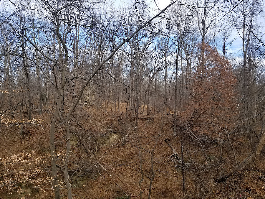 old structure across the railroad