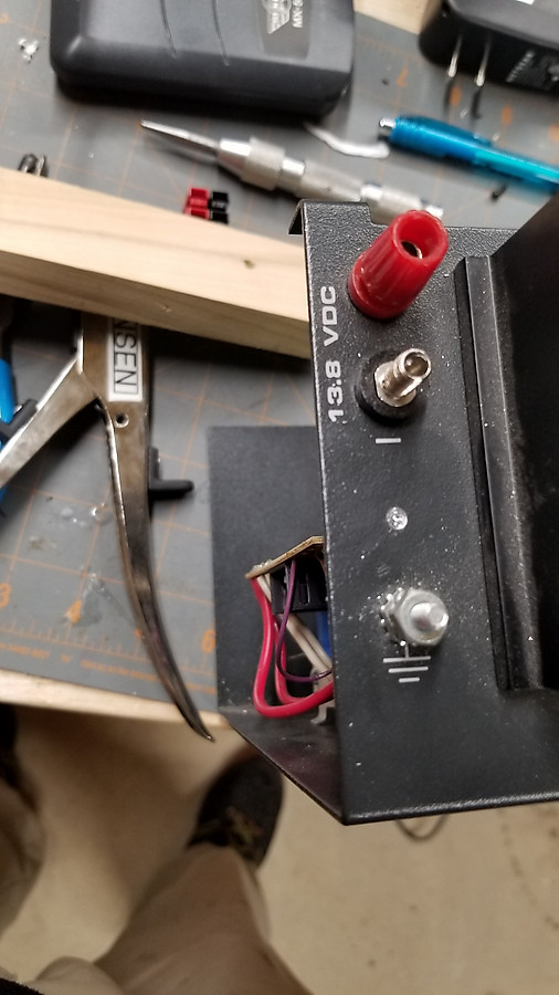 old Astron power supply with missing and weirdly threaded negative lead, decided to cut hole and install Anderson PowerPoles