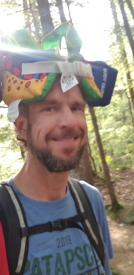 dinosaur floaty doubles as a beer hat