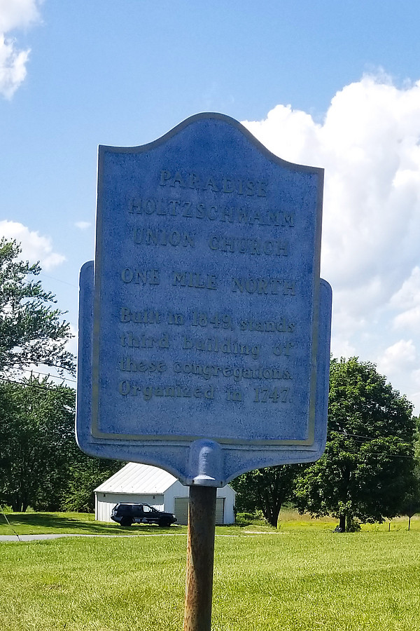 Paradise Holtzschwamm Union Church, one mile north, Built in 1849, stands third building of these congregations. Organized in 1747.