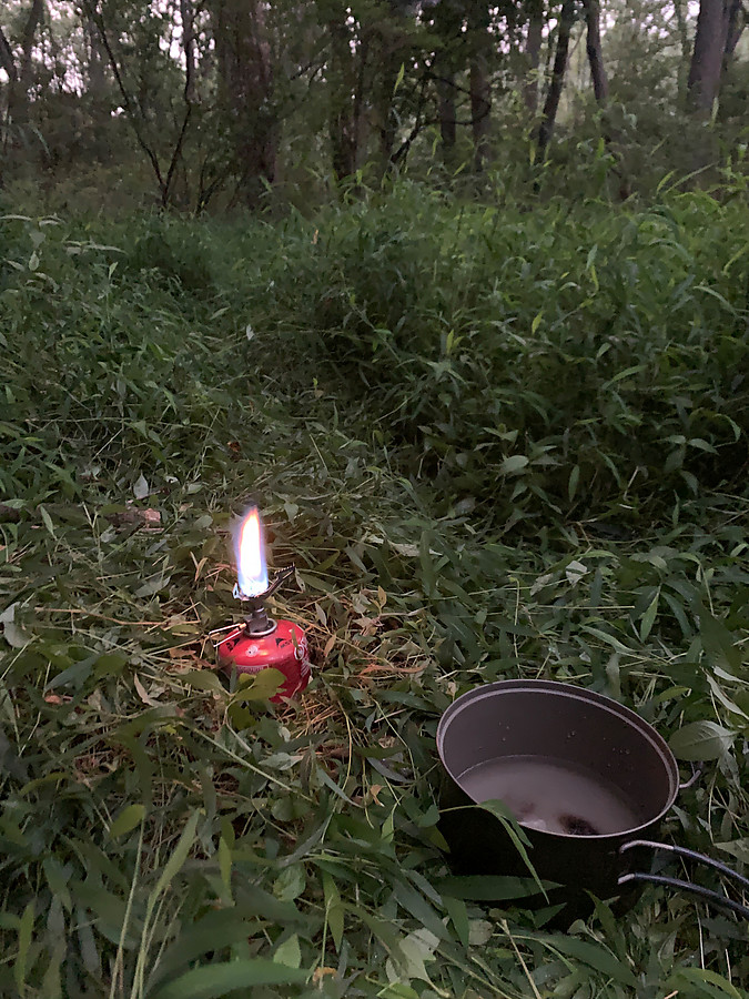 left only some trampled grass here and hopefully didn't bring home any ticks. Just lit the stove for some coffee while packing up.