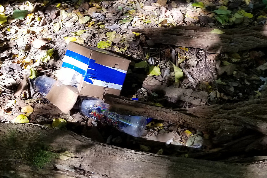 picking up the remains of the cache that fell prey to animals because I didn't put it in a solid container - luckily they  left the water