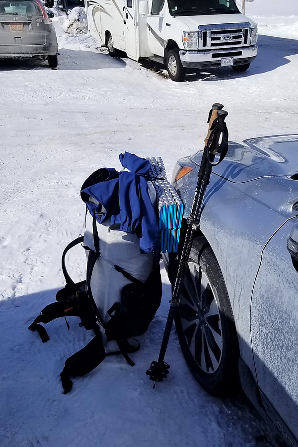 strapping system on pack looks silly but with a few feet of snow up top you have to duck under a lot of snow-covered branches, so anything to lower the height of the pack helps