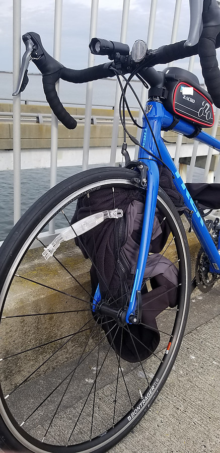 this jacket got caught in the fork/wheel of their bike and sent them over the bars at speed while descending the bridge. I'm hopeful for a good outcome but the helmet was destroyed and initially the victim reported numbness on one side.