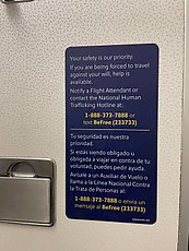 new human trafficking signage in airplane bathrooms