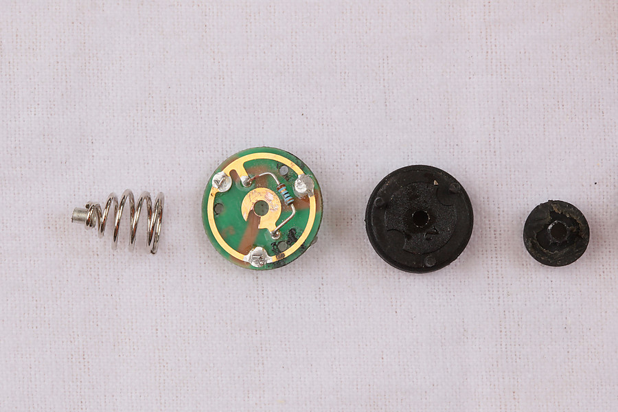I scratched up the PCB a bit grinding the spring out