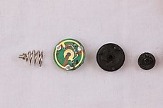 I scratched up the PCB a bit grinding the spring out