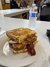 french toast, bacon, sausage, ham, eggs, and cheese, and well made